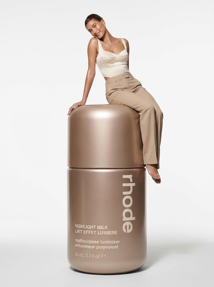 Create an ultra-detailed hyper-realistic beauty editorial photograph of a model interac...