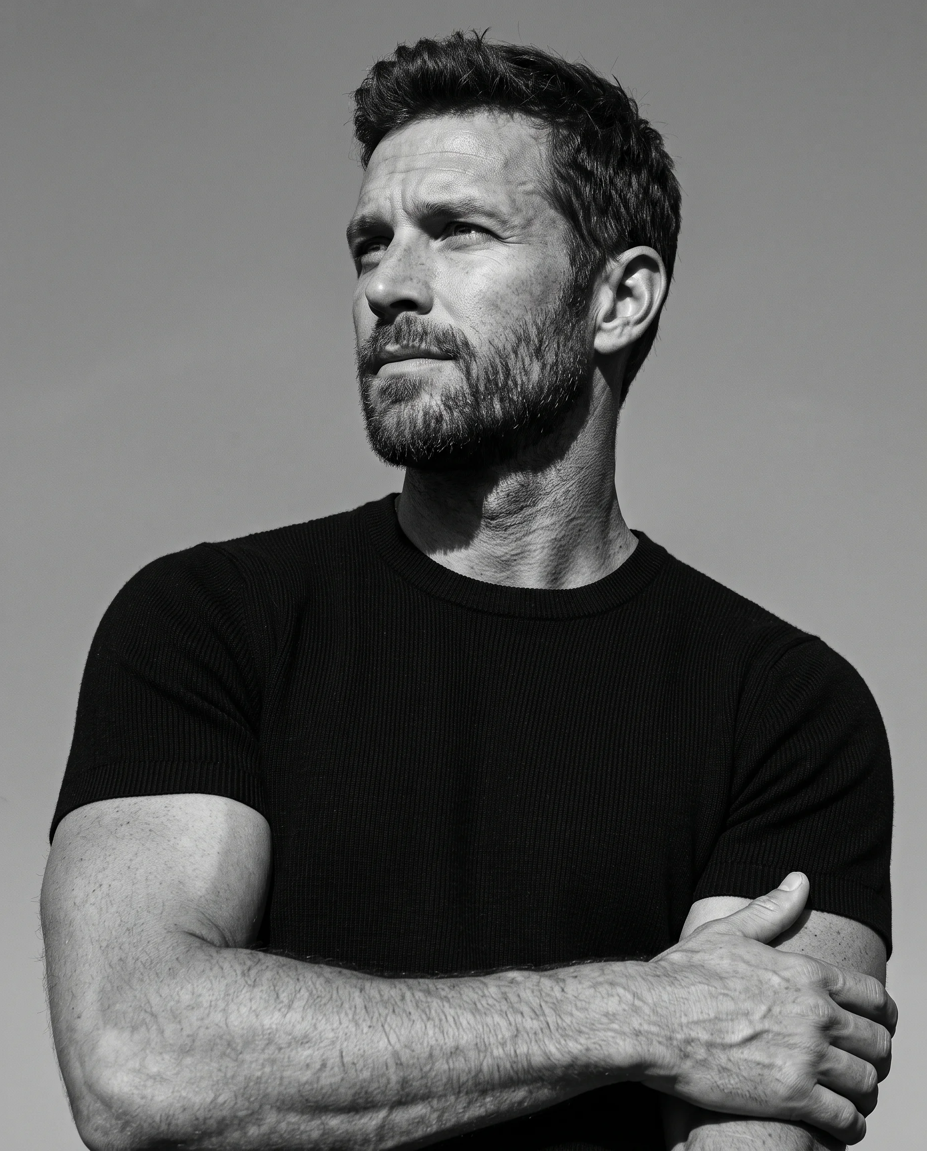 Ultra-realistic black-and-white editorial portrait, low-a...
